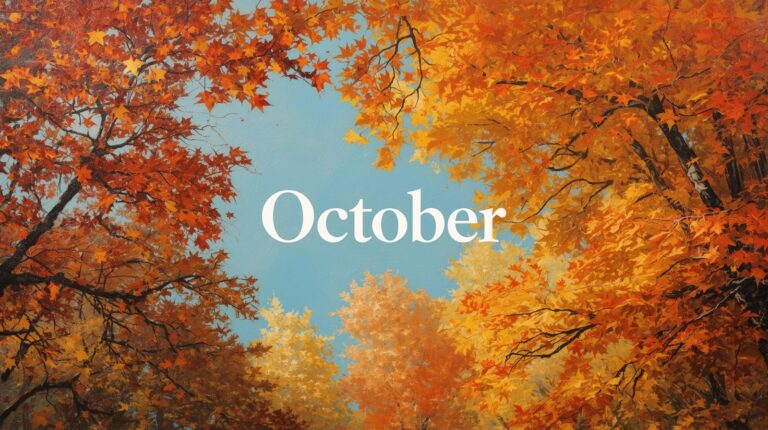 紅葉する木々の隙間に見える青空、真ん中に「October」のロゴあり